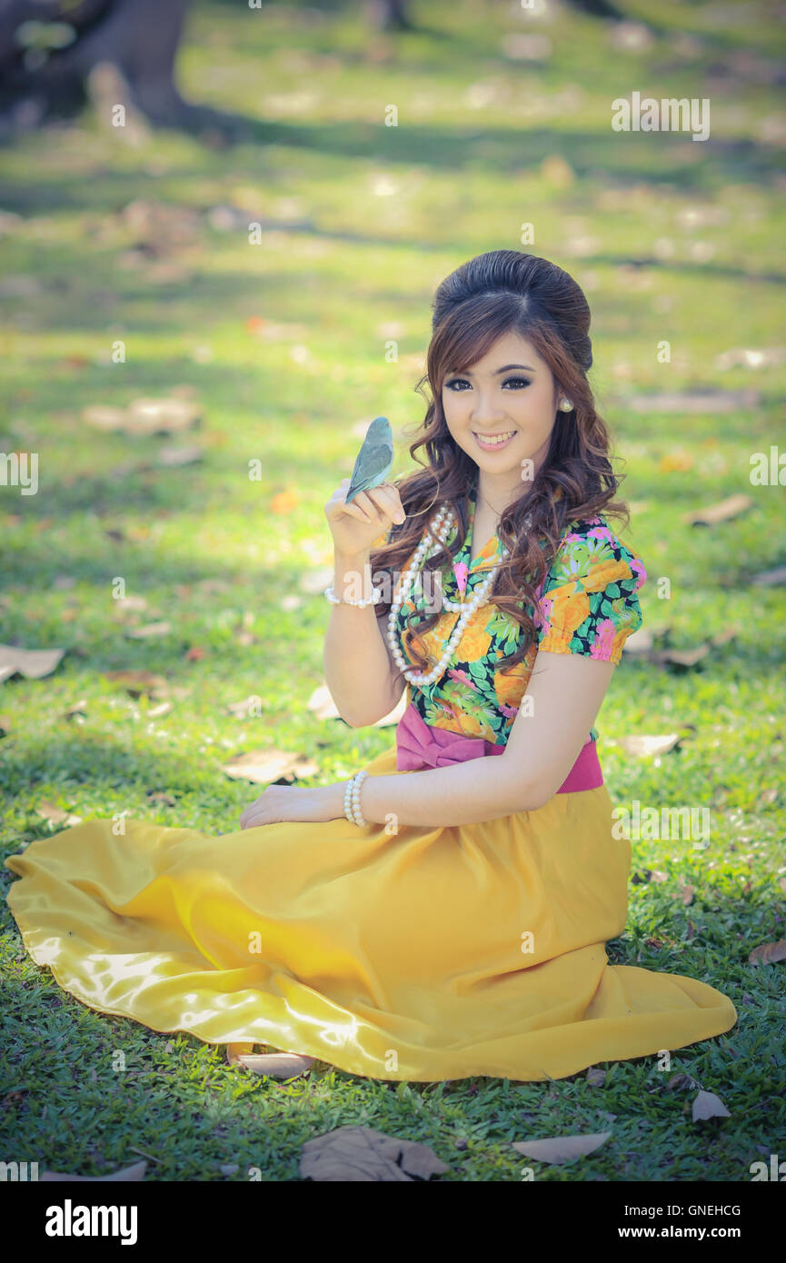 asia beautiful girl in the yellow dress on nature Stock Photo - Alamy
