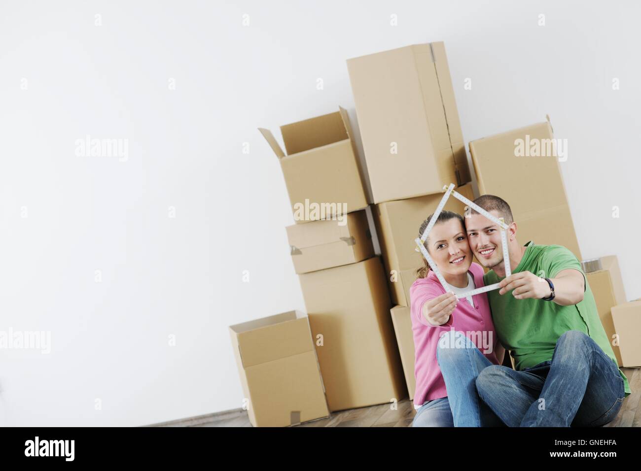 Young couple moving in new house Stock Photo - Alamy