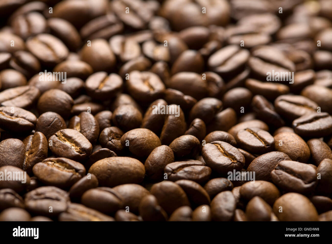 roasted coffee beans background Stock Photo - Alamy