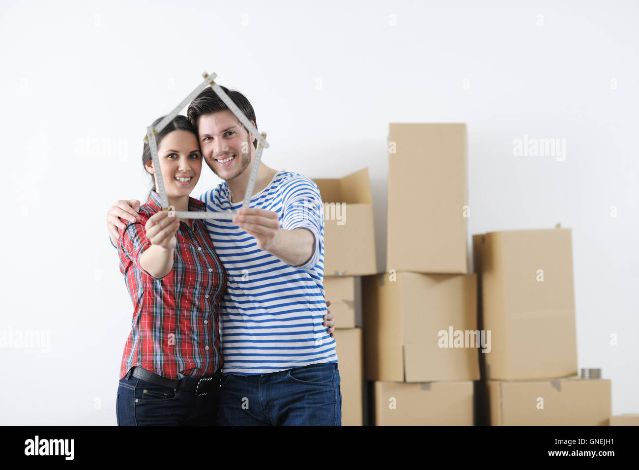 Young couple moving in new home Stock Photo - Alamy