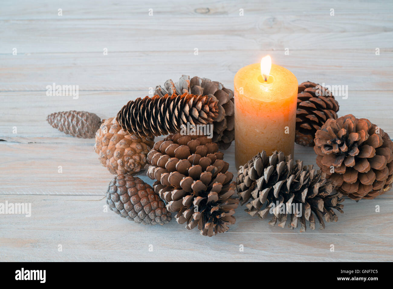 center table with Christmas candle and pine cones. Copy space Stock Photo -  Alamy