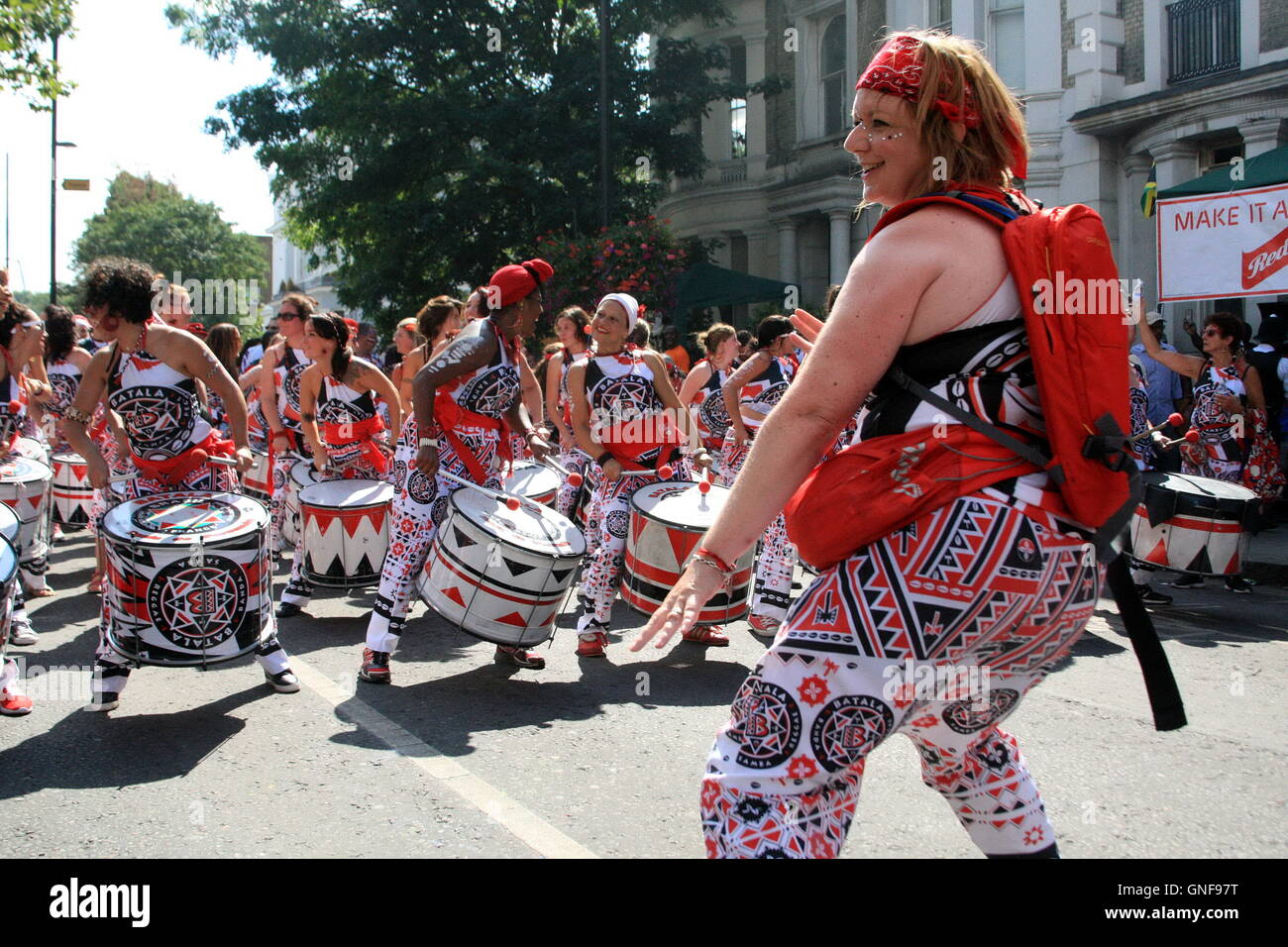 London, UK.  29th August 2016.  Batala London Perform at Europe's largest street festival, Notting Hill Carnival.  The second of two days of street festival where members of the public perform music and dancing, dressed in brightly coloured costumes, in a carnival procession.   They take part on foot or riding on colourful floats through the streets filled with spectators. The vast festival area, with many food vendors and stages hosting live bands, fills the streets with people enjoying the bank holiday.   Bliss Lane/Alamy Live News Stock Photo