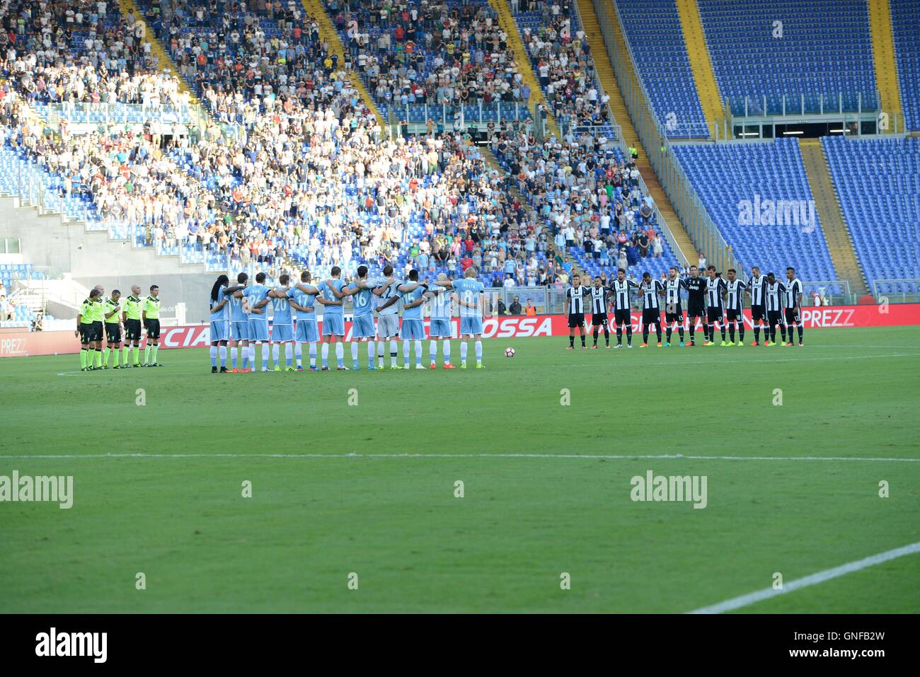 F.C. Juventus and S.S. Lazio deployed in midfield in memory of the victims of the earthquake in Italy Centre during the Italian Serie A football match between S.S. Lazio and F.C. Juventus at the Olympic Stadium in Rome, on august 27, 2016. Stock Photo