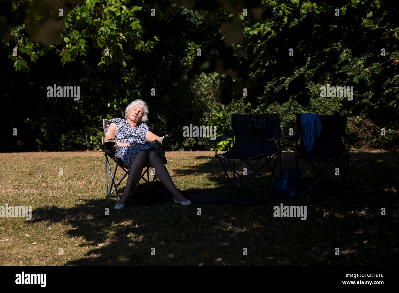 London, UK. 30th Aug, 2016. UK Weather: A woman sleeps in the sun on Hampstead Heath during hot summer day in London. Credit:  Joel Ford/Alamy Live News Stock Photo