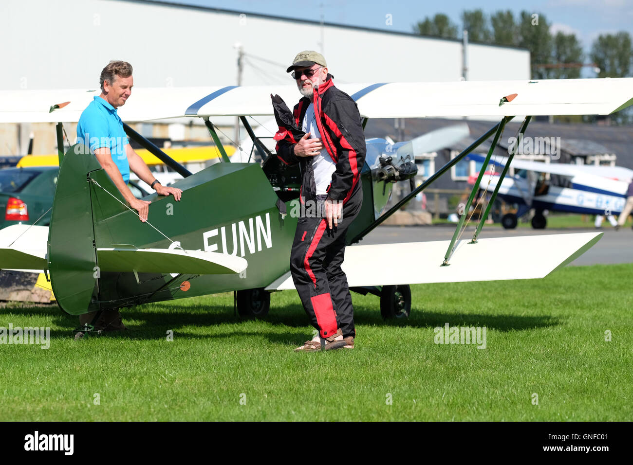 Shobdon airfield, Herefordshire, UK August 2016. Forty aircraft visited Shobdon airfield today in fine weather as part of the Light Aircraft Association ( LAA ) UK Tour 2016 including this homebuilt Plumb biplane. This year the LAA is celebrating 70 years since it was originally founded as the Popular Flying Association ( PFA ). Stock Photo