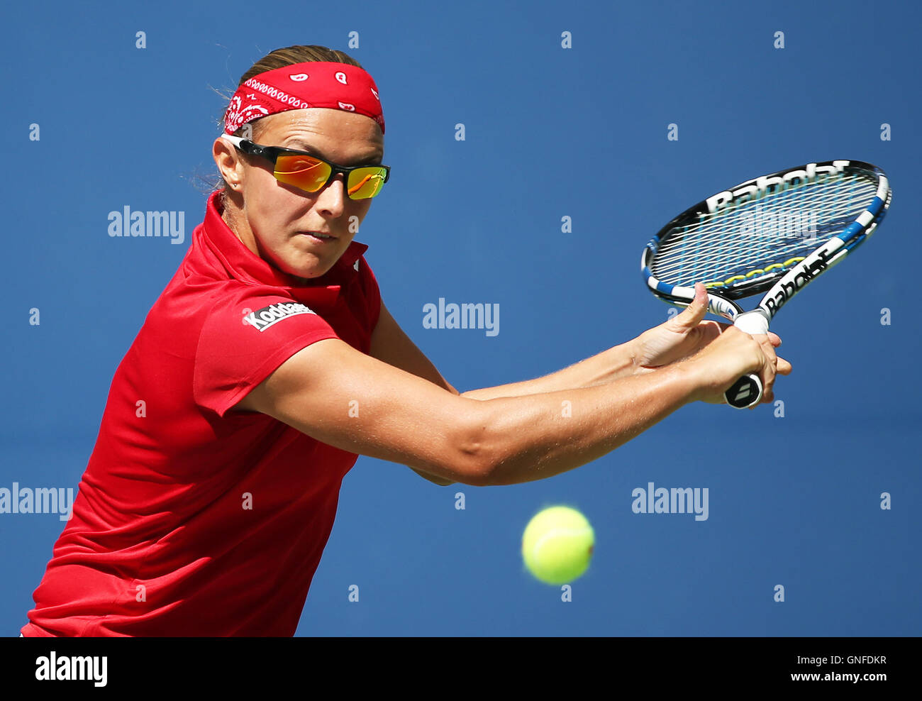 New York, USA. 30th Aug, 2016. Kirsten Flipkens of Belgium returns a ball to Simona Halep of Romania during a match of the women's singles first round at the 2016 U.S. Open in New York, the United States, Aug. 30, 2016. Simona Halep won 2-0. Credit:  Qin Lang/Xinhua/Alamy Live News Stock Photo