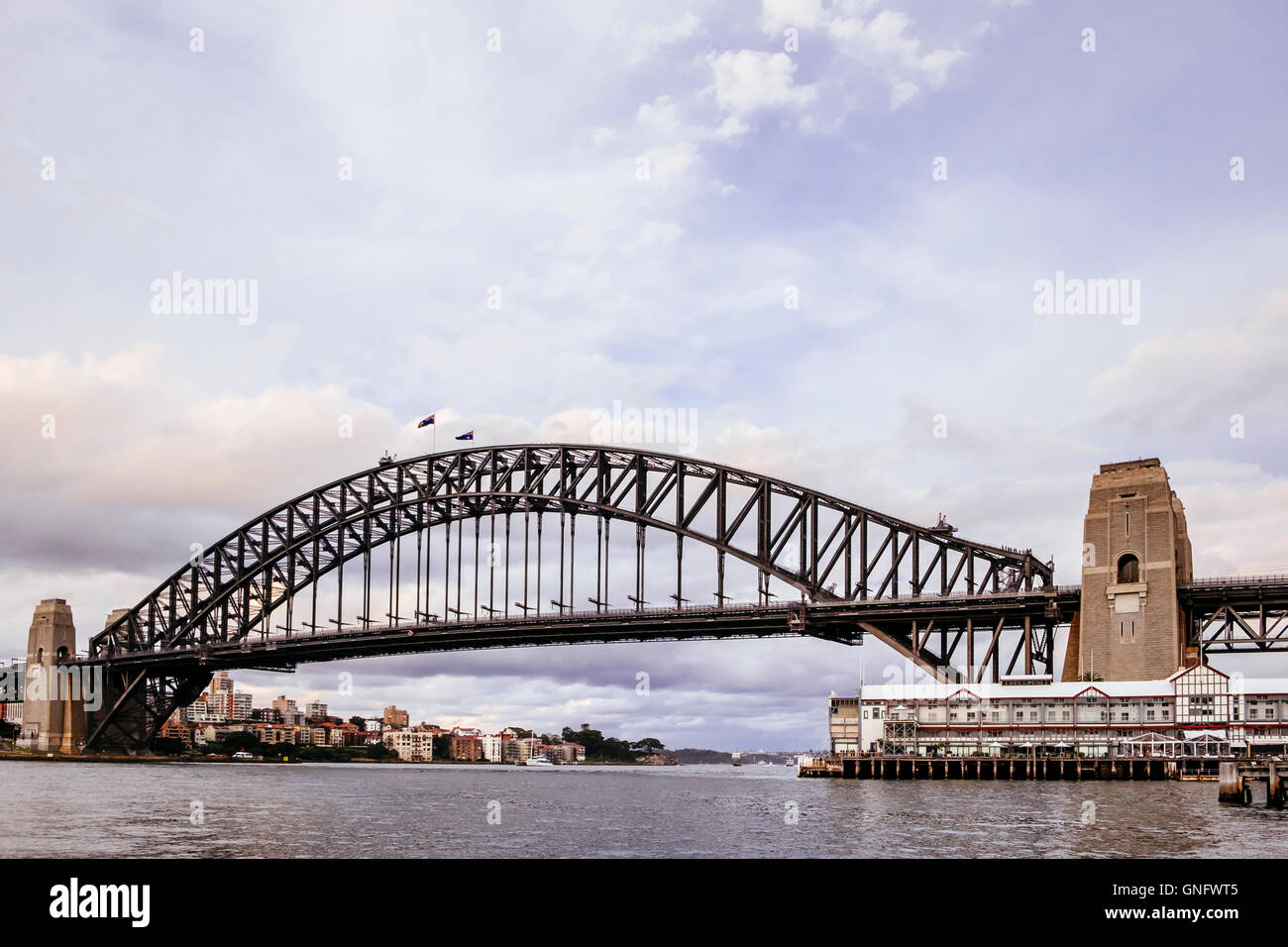 Sydney Harbour Bridge with Walsh Bay wharves in foreground, Sydney, New South Wales,  Australia Stock Photo