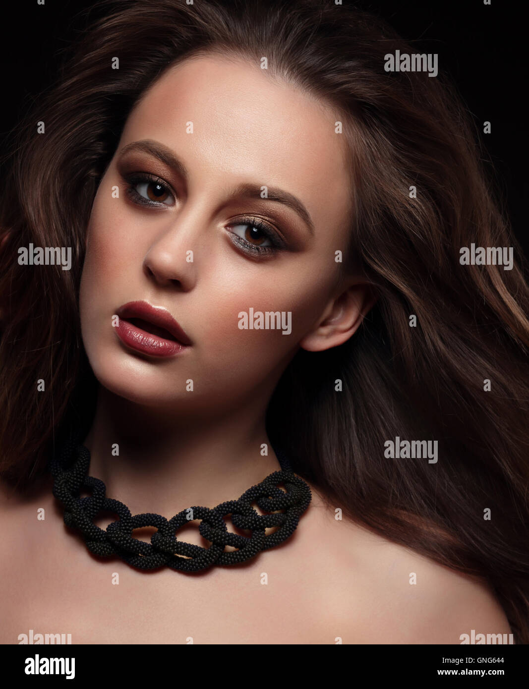 Beautiful young woman close-up portrait. Professional makeup. Stock Photo