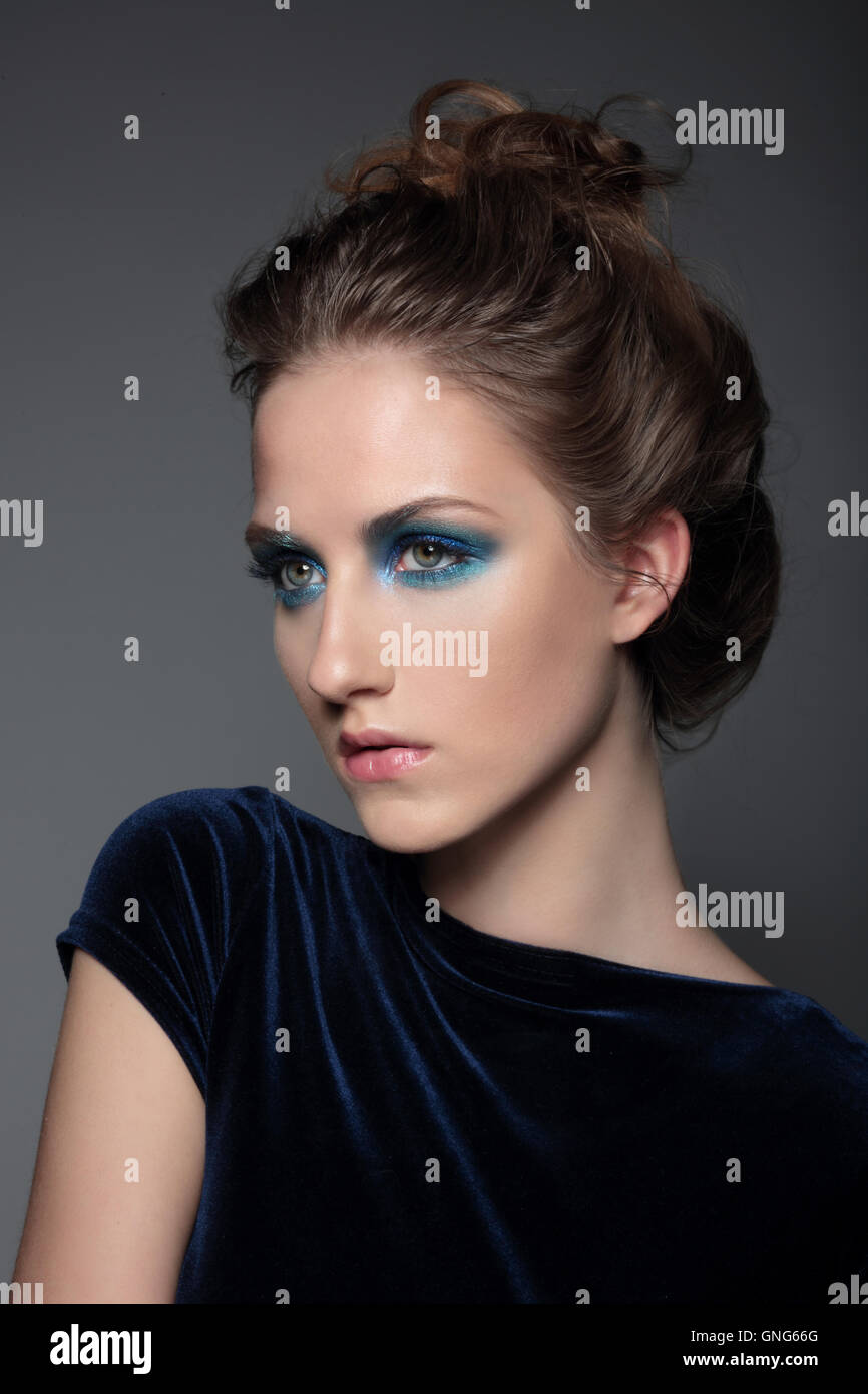 Fashion photo of a young woman. Cosmetic Eyeshadows, eyebrows. Beauty Girl with Perfect Skin. Stock Photo
