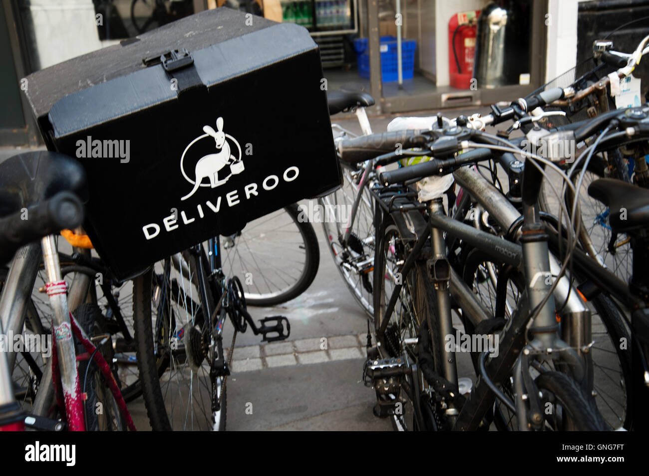 London. Liverpool Street station. Deliveroo delivery box on the back of