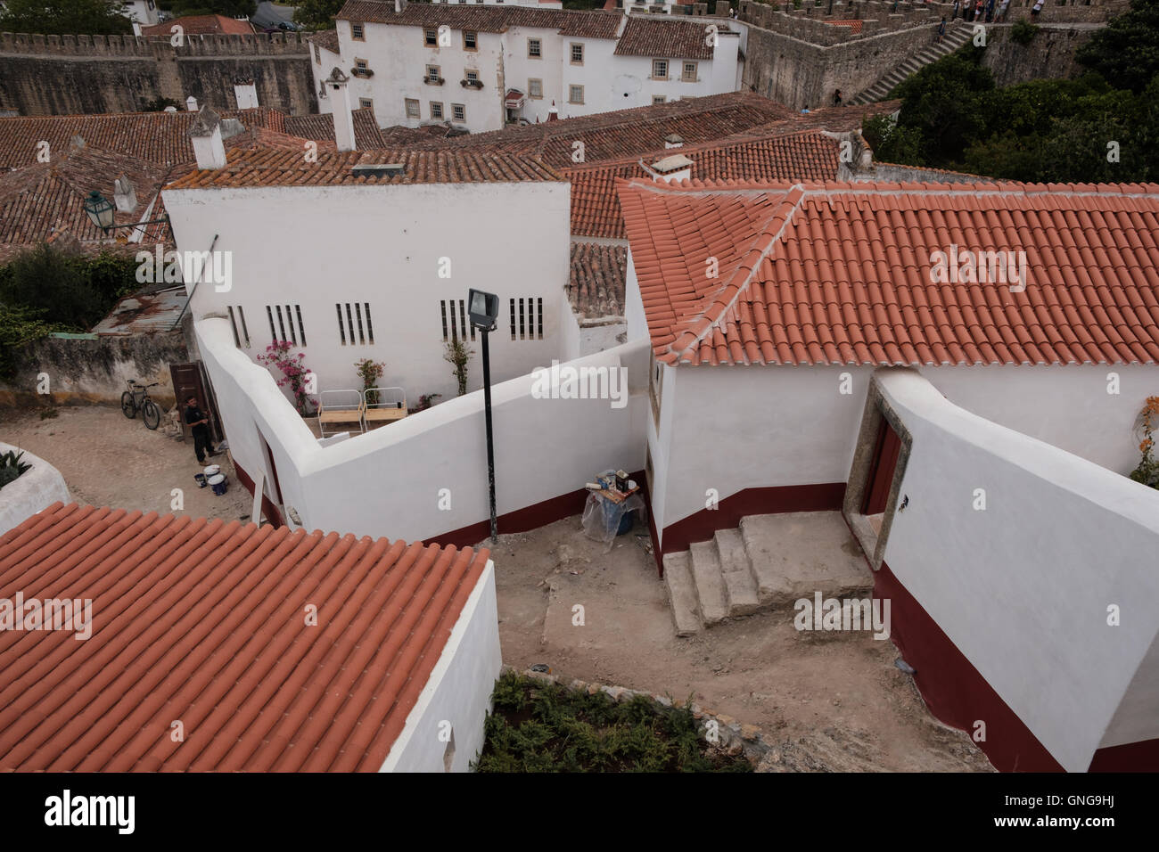 Traditional tiled rooves of the medieval walled town of Obidos, Portugal. Stock Photo