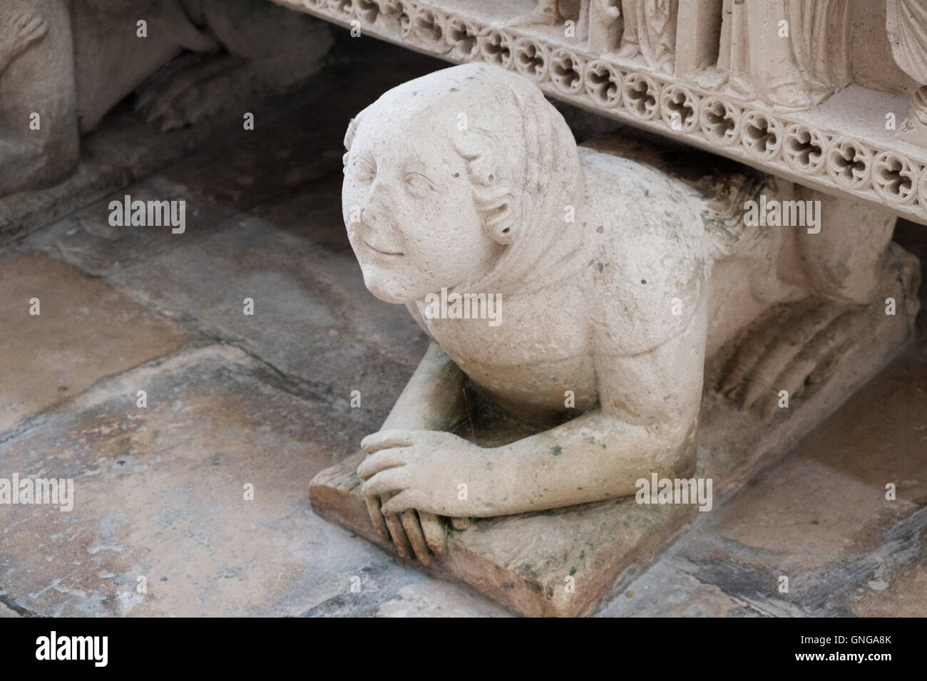 One of six mythic creatures supporting the Gothic royal tomb of Inês de Castro  in the Alcobaça Monastery, Portugal. Stock Photo