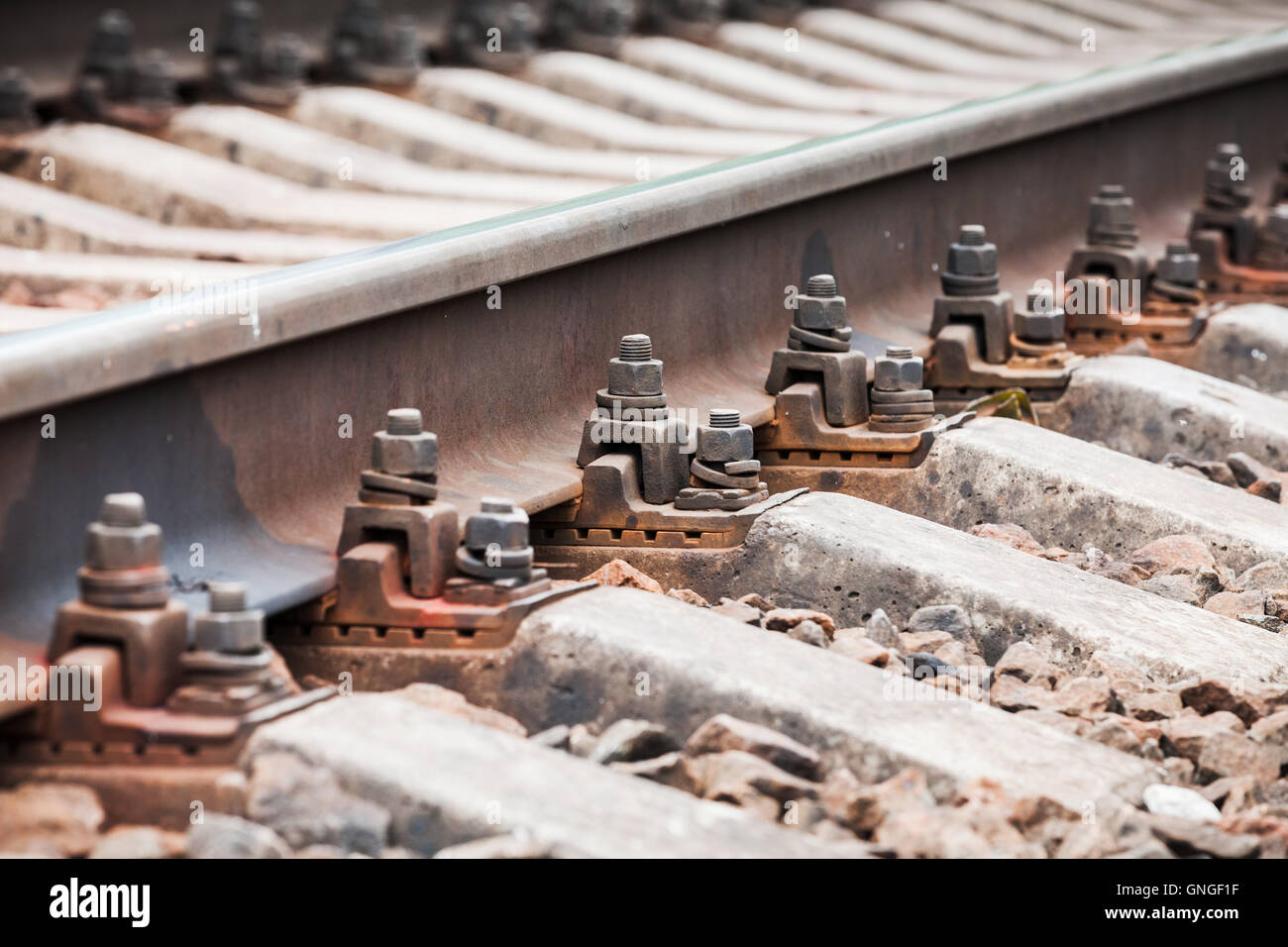 Modern railway track details, close up photo with selective focus Stock Photo