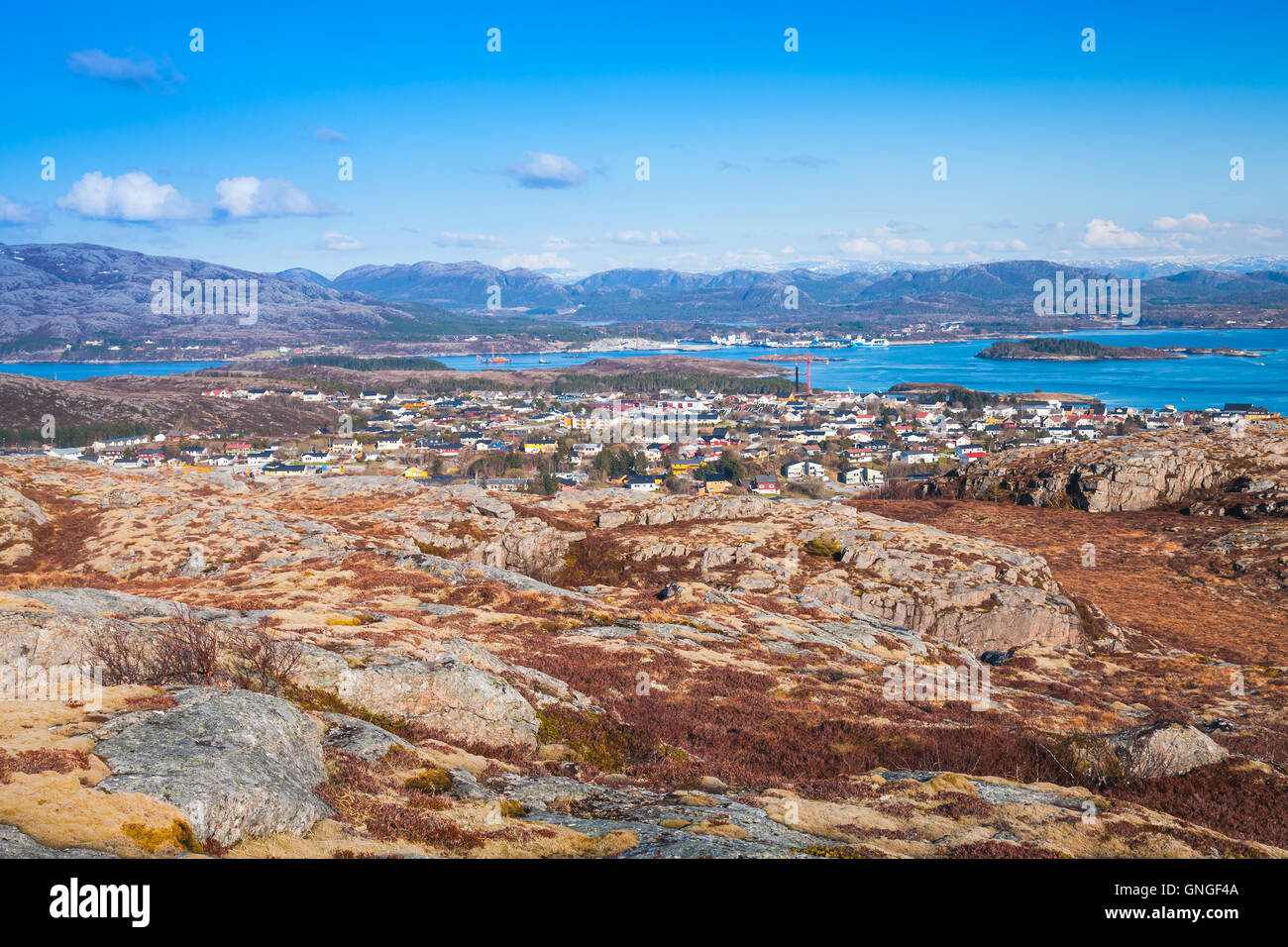 Northern Norway in springtime. Mountain landscape with red moss growing on rocks Stock Photo
