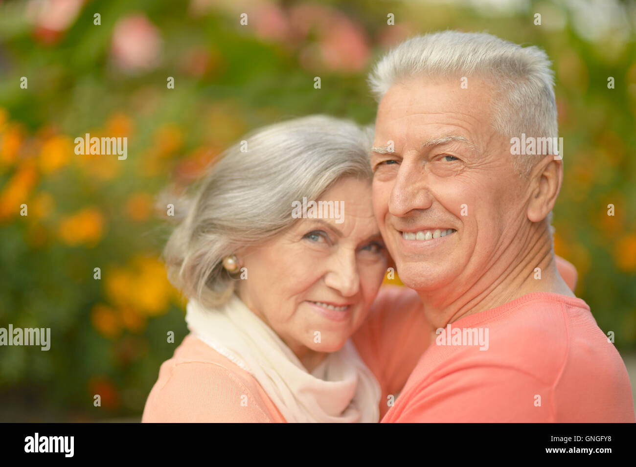 Senior couple in autumn park Stock Photo - Alamy