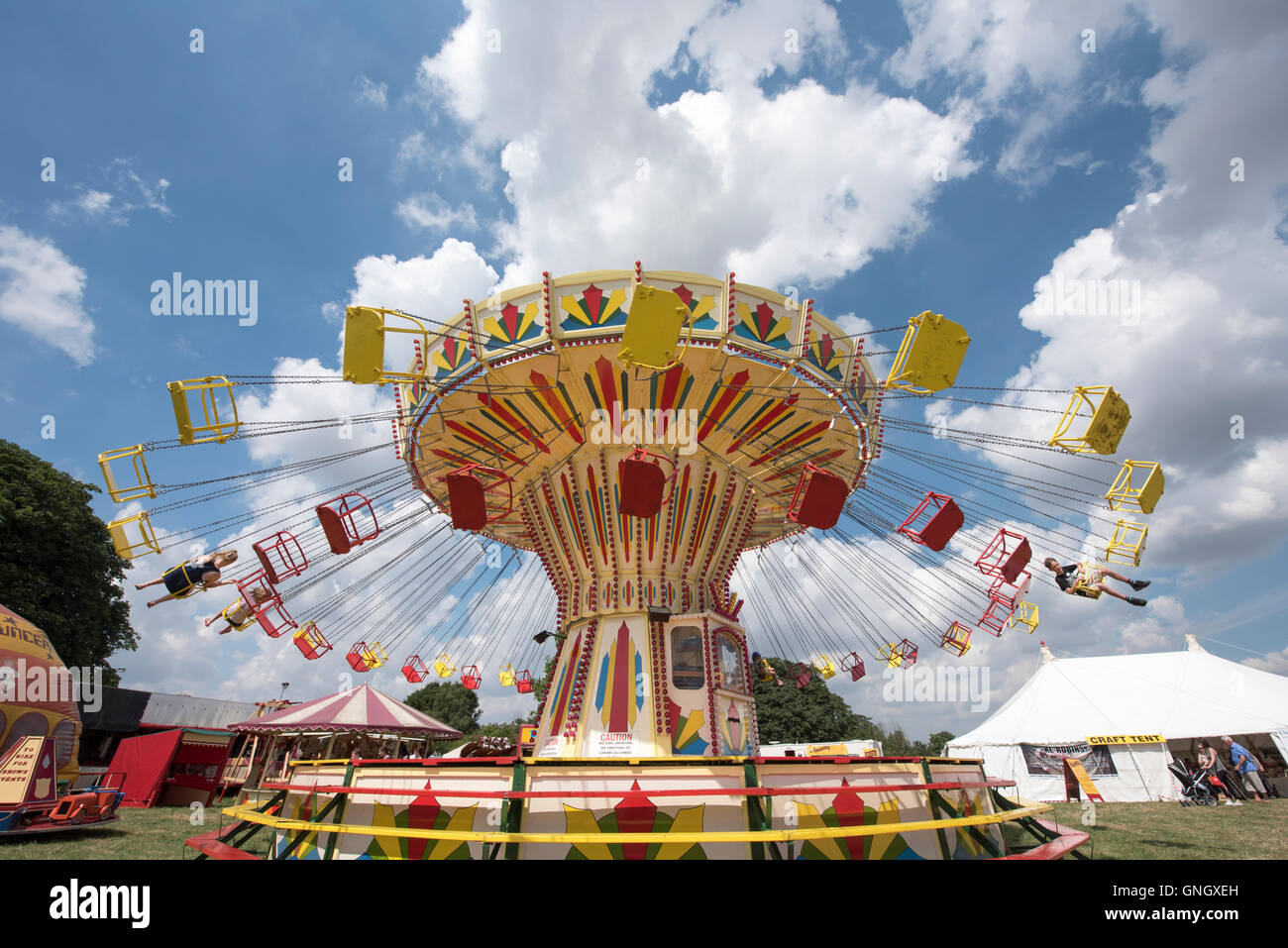 Youths Enjoying Flying Chair Ride At Funfair At Stow Cum Quy 