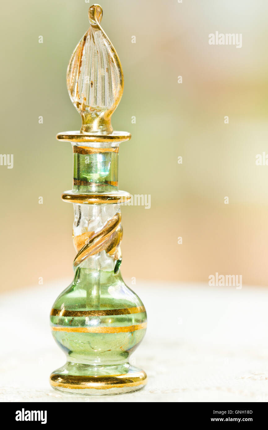Small ornate perfume bottle with applicator stopper Stock Photo Alamy