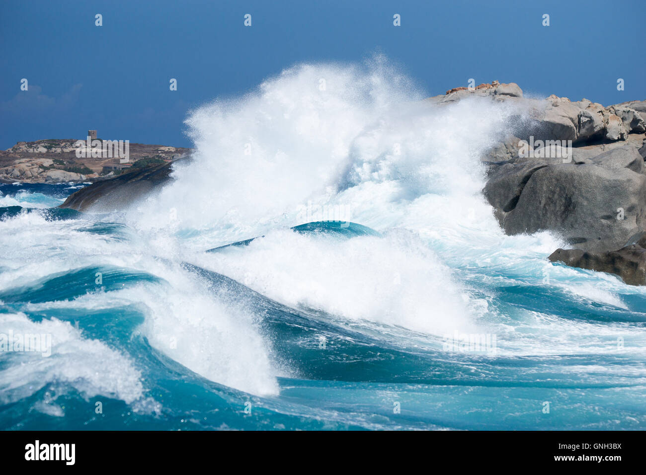 Waves hitting rocks along coastline near Calvi, Corsica, France Stock Photo