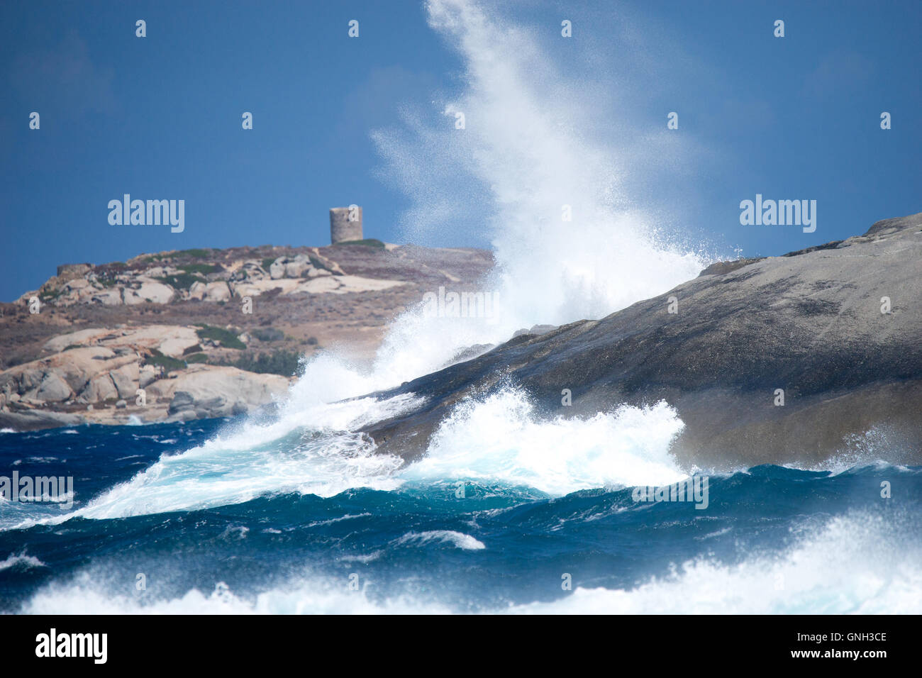 Waves hitting rocks along coastline near Calvi, Corsica, France Stock Photo