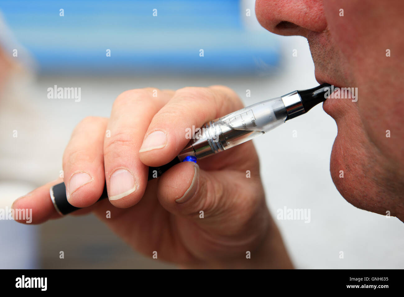 Man vaping on an electronic cigarette Stock Photo