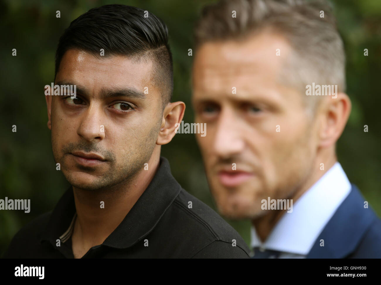 Head of crime operations for Edinburgh CID DCI Martin MacLean (right) with Sadat Ahmed, the brother of Saima Ahmed, near to the location where her body was found at Gogarburn Golf Club in Newbridge. Stock Photo
