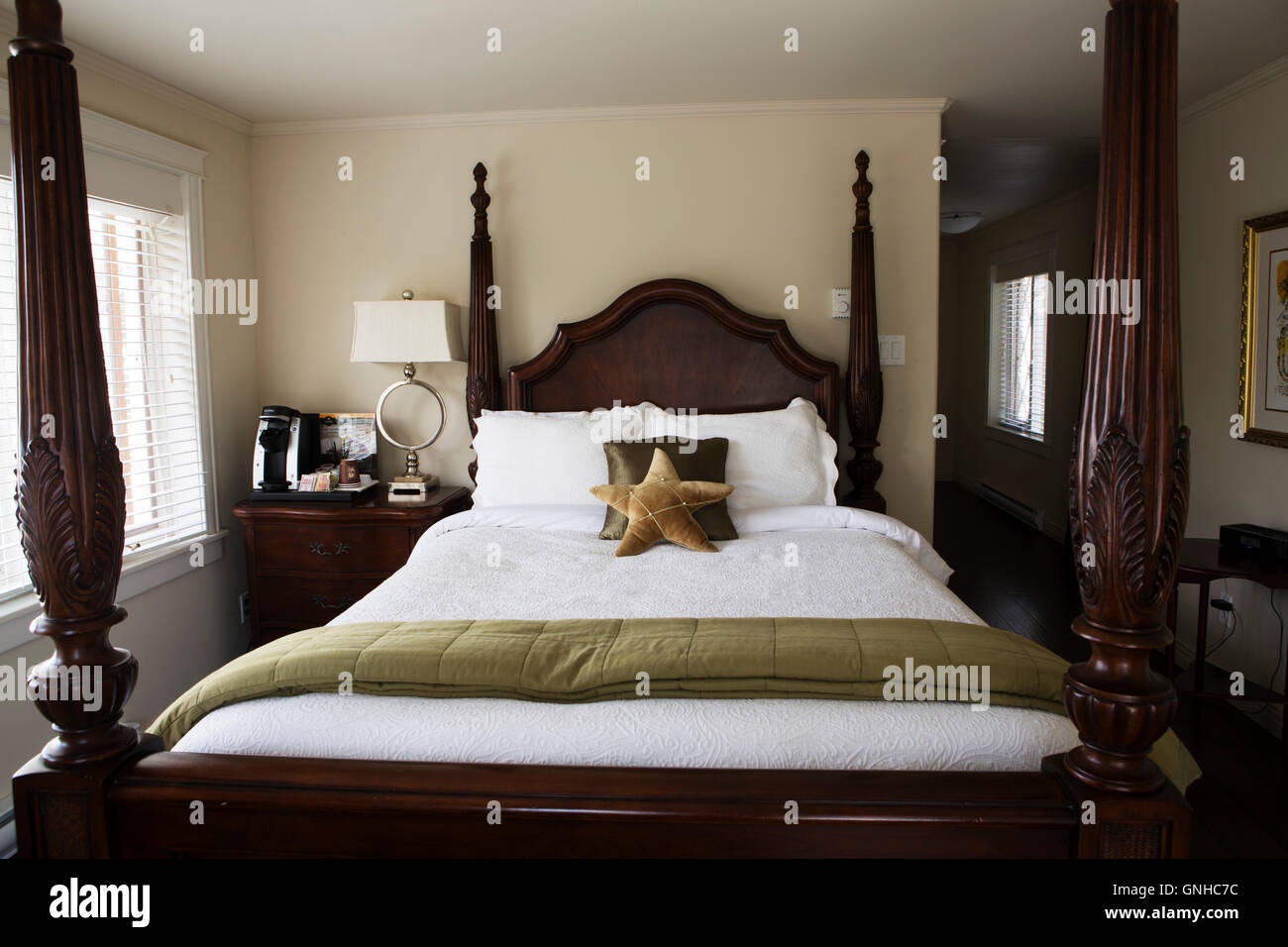 A four poster bed in a guestroom at the Doctor's House Inn and Spa at Green's Harbour in Newfoundland and Labrador, Canada. The Stock Photo