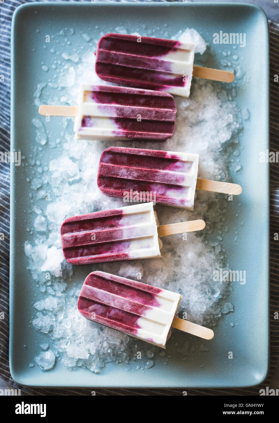 Berry cream popsicles. Stock Photo