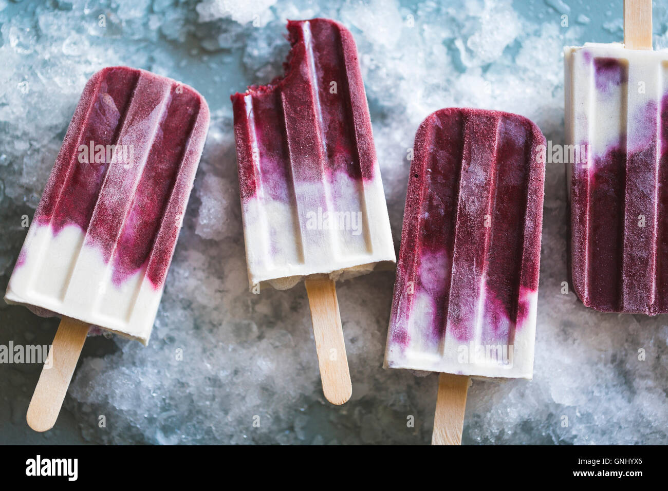 Berry cream popsicles. Stock Photo