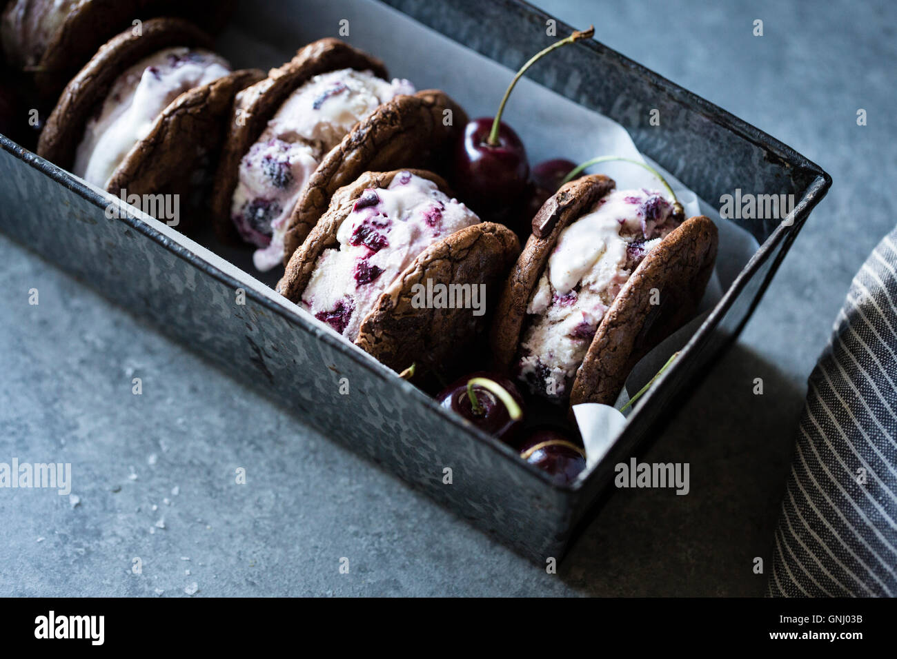 Roasted cherry ice cream sandwiches with salted double chocolate buckwheat cookies (gluten-free) Stock Photo