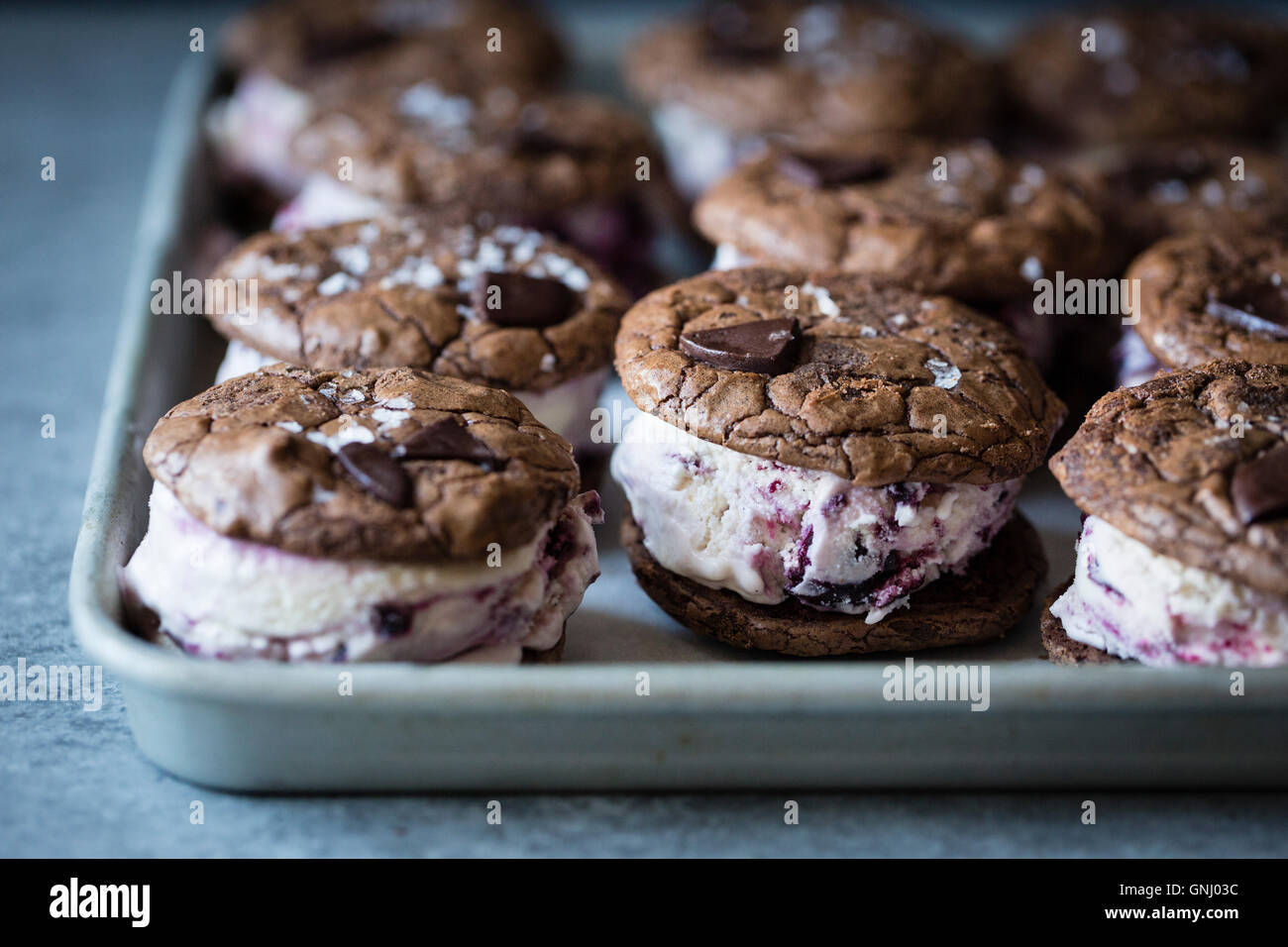 Roasted cherry ice cream sandwiches with salted double chocolate buckwheat cookies (gluten-free) Stock Photo