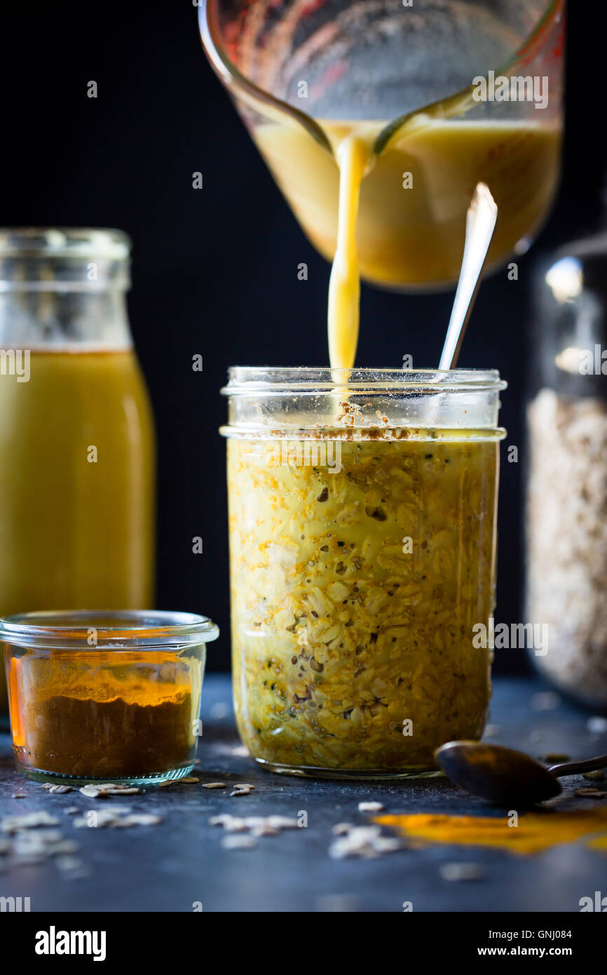 Cooking Golden milk overnight oats (gluten free) Stock Photo