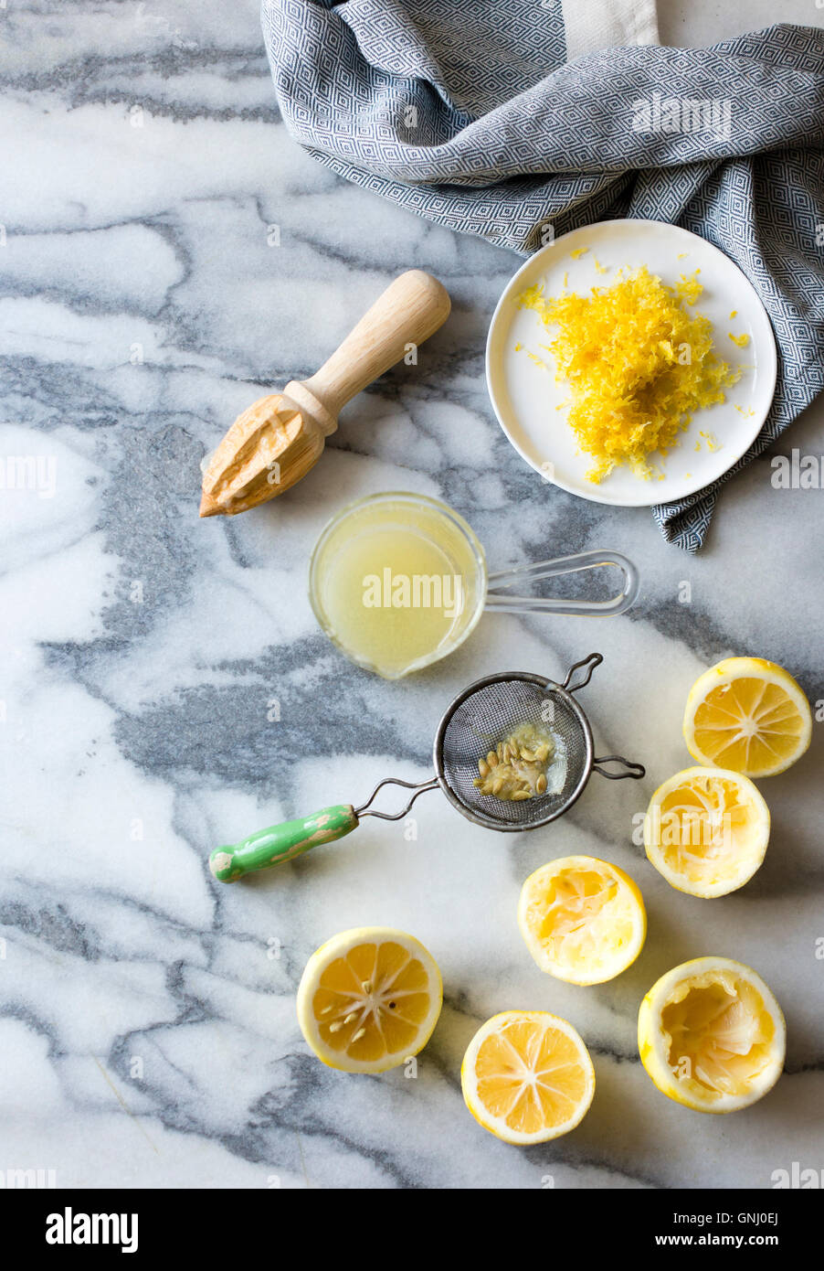 Lemons for cooking. Juiced, grated, de-pipped, with seive and juicer. Stock Photo