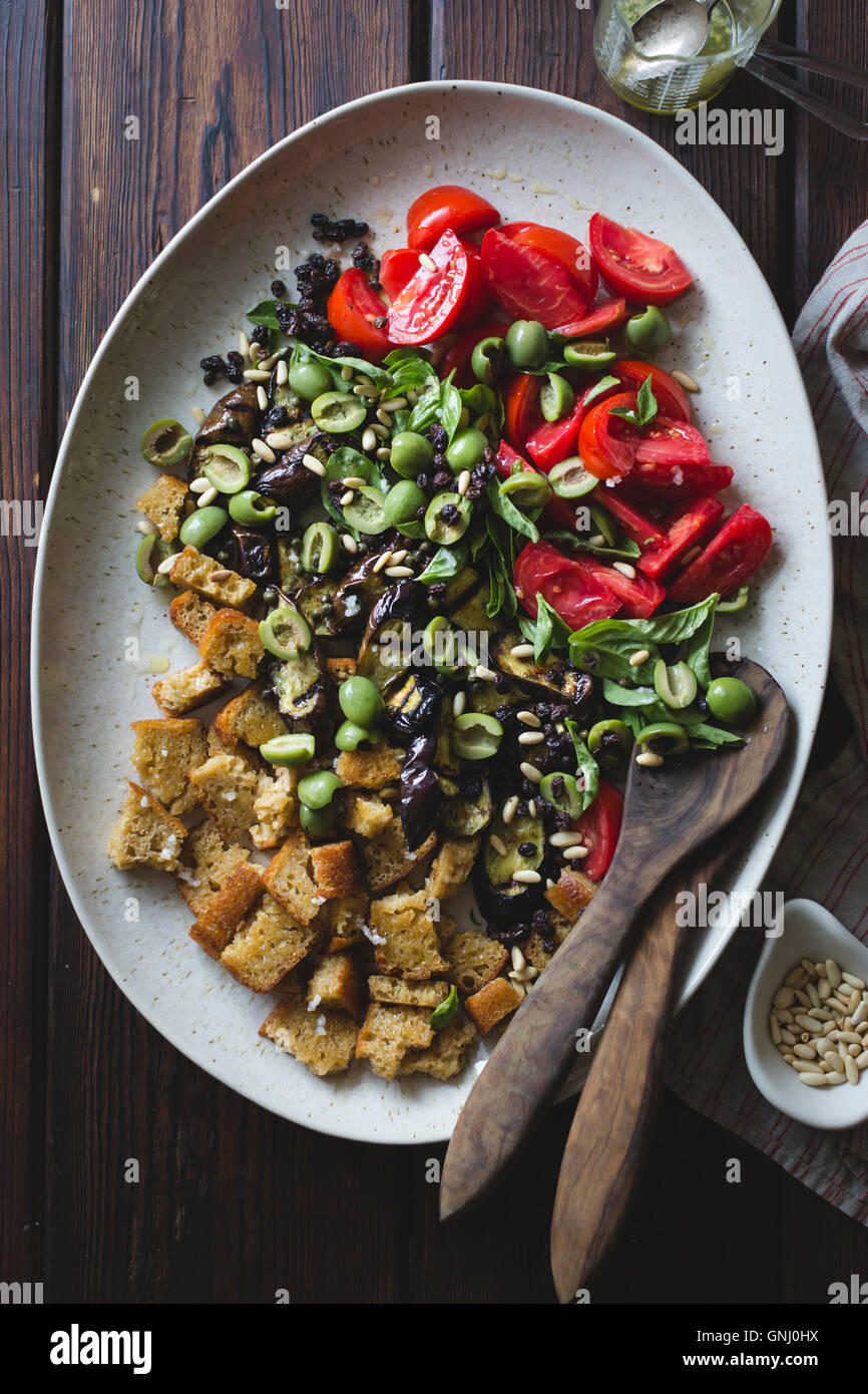Roasted eggplant panzanella with capers, olives, and pine nuts, gluten