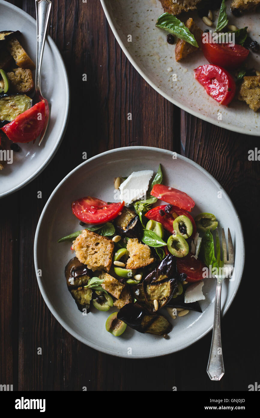Roasted eggplant panzanella with capers, olives, and pine nuts, gluten
