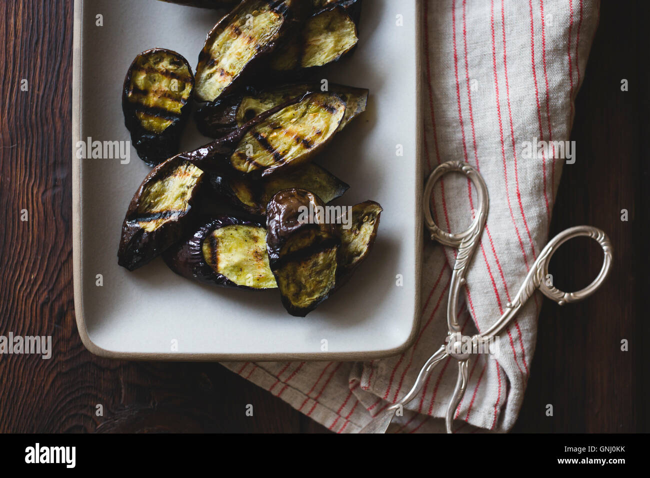 Eggplant in a serving dish Stock Photo