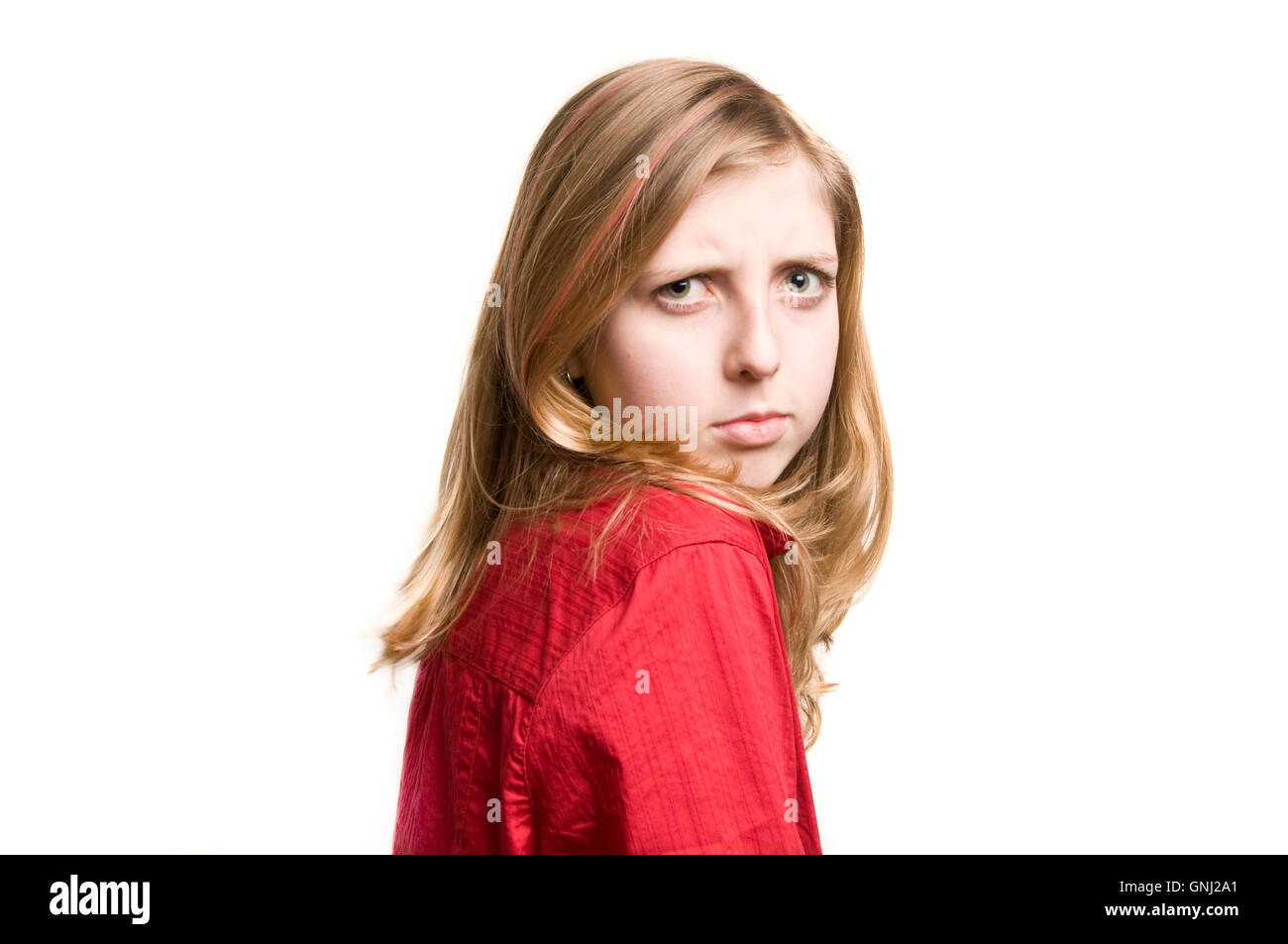 blond tween girl making a face expression of disappointment Stock Photo