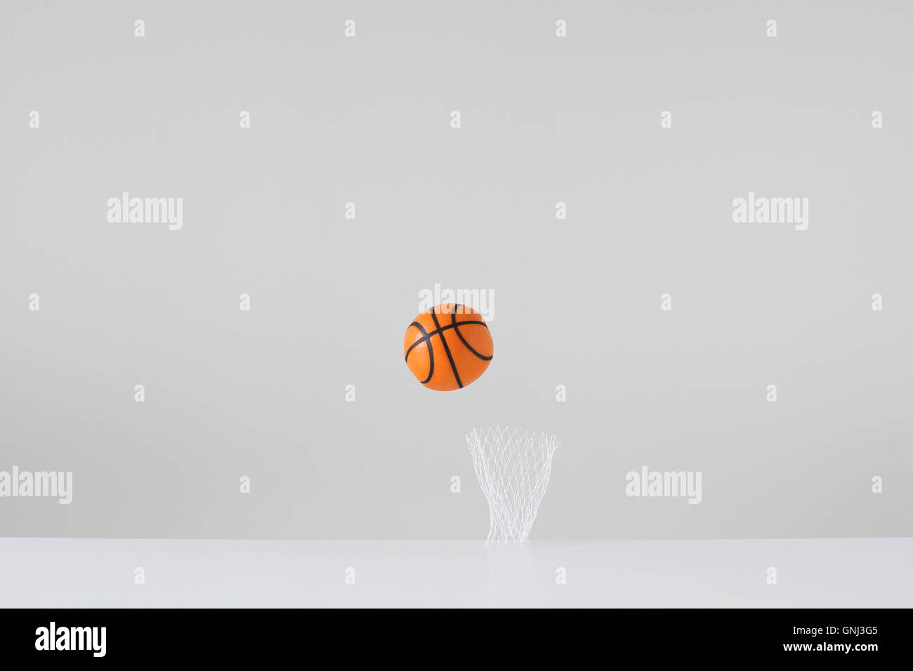 Conceptual basketball and net Stock Photo