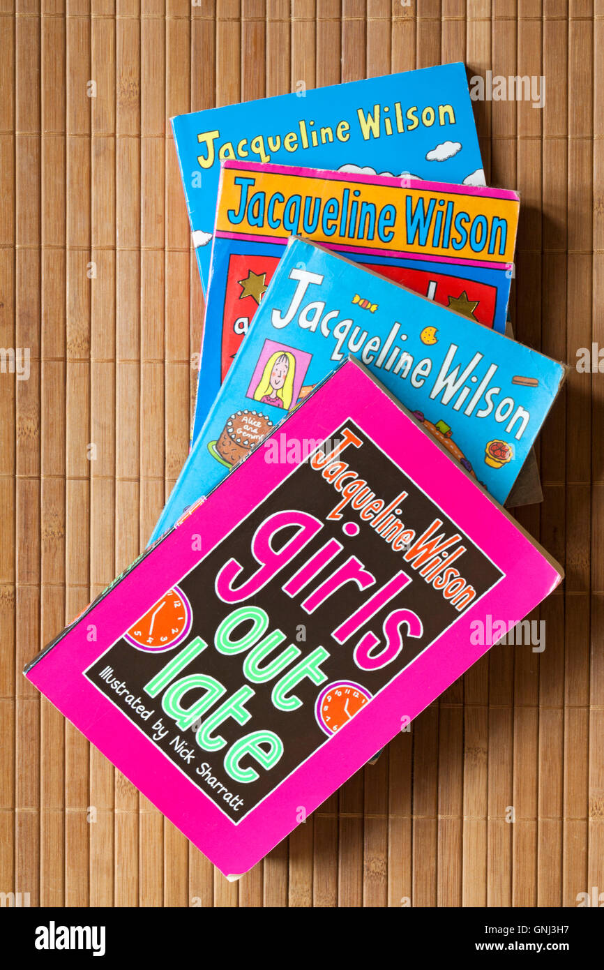 Pile of well loved Jacqueline Wilson books with Girls Out Late on top Stock Photo