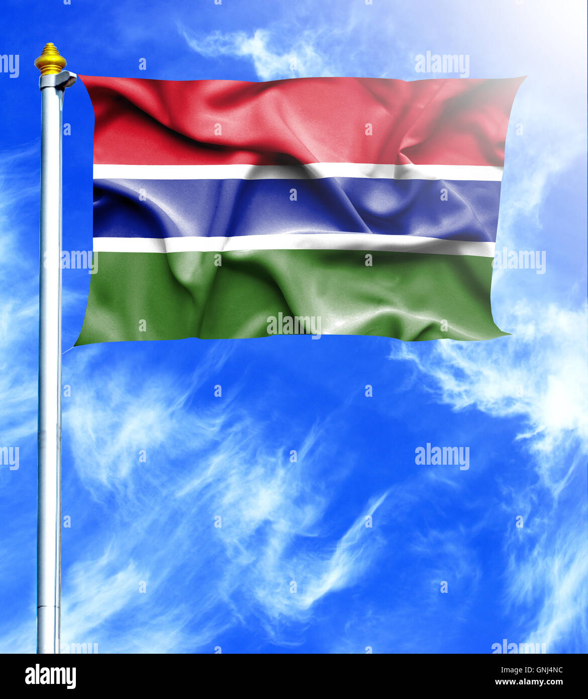 Blue sky and mast with hanged waving flag of Gambia Stock Photo - Alamy