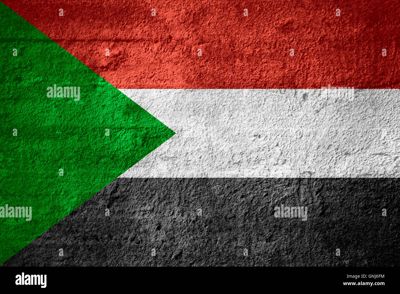 flag of Sudan or Sudanese banner on rough texture Stock Photo