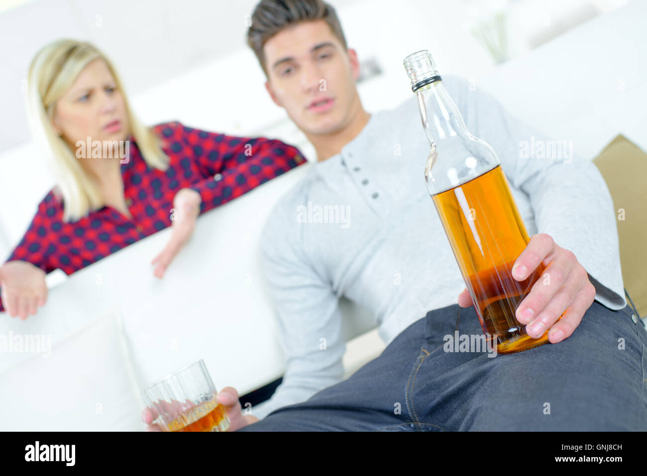 Woman angry that her boyfriend is drunk Stock Photo