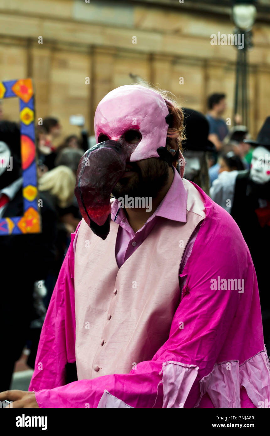 Scary-looking man wearing a flamingo face mask taking part in the part of the Edinburgh Jazz Festival Stock Photo - Alamy