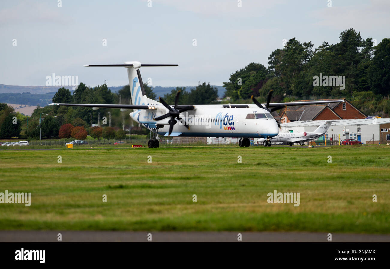 A twin engine turboprop Flybe Dash-8 aircraft has just landed at the Dundee Airport, UK Stock Photo