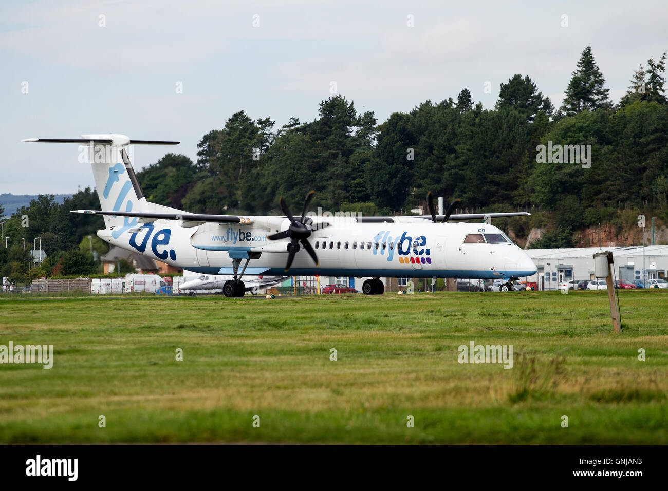 A twin engine turboprop Flybe Dash-8 aircraft has just landed at the Dundee Airport, UK Stock Photo