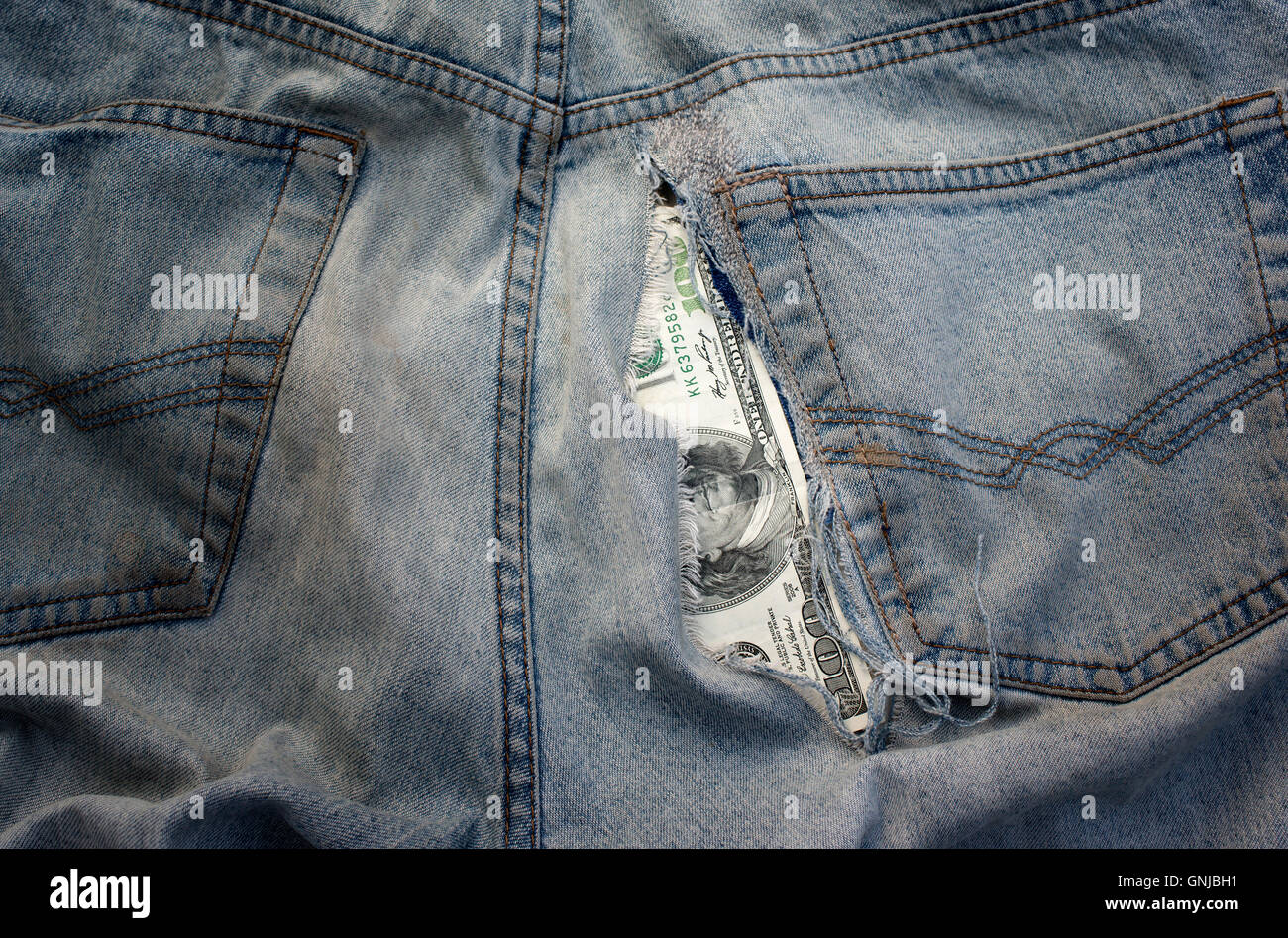Hole In Jeans Stock Photo - Alamy