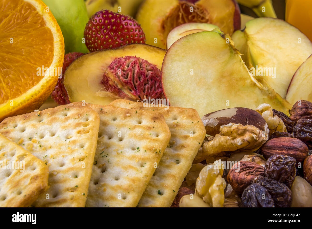 Snacks background fruits nuts crackers Stock Photo