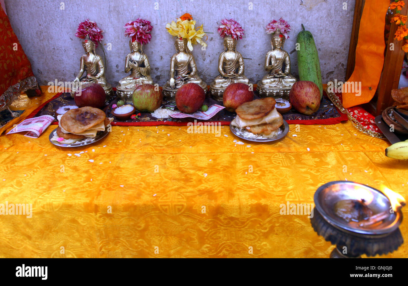 Kathmandu, Nepal. 30th Aug, 2016. Displayed Buddhist antiques are seen during Pancha Dan festival in Kathmandu, Nepal. Pancha Dan is the festival of five summer gifts is observed by donating the five elements rice grains, unhusked rice grains, salt, money and pulses. Credit:  Archana Shrestha/Pacific Press/Alamy Live News Stock Photo