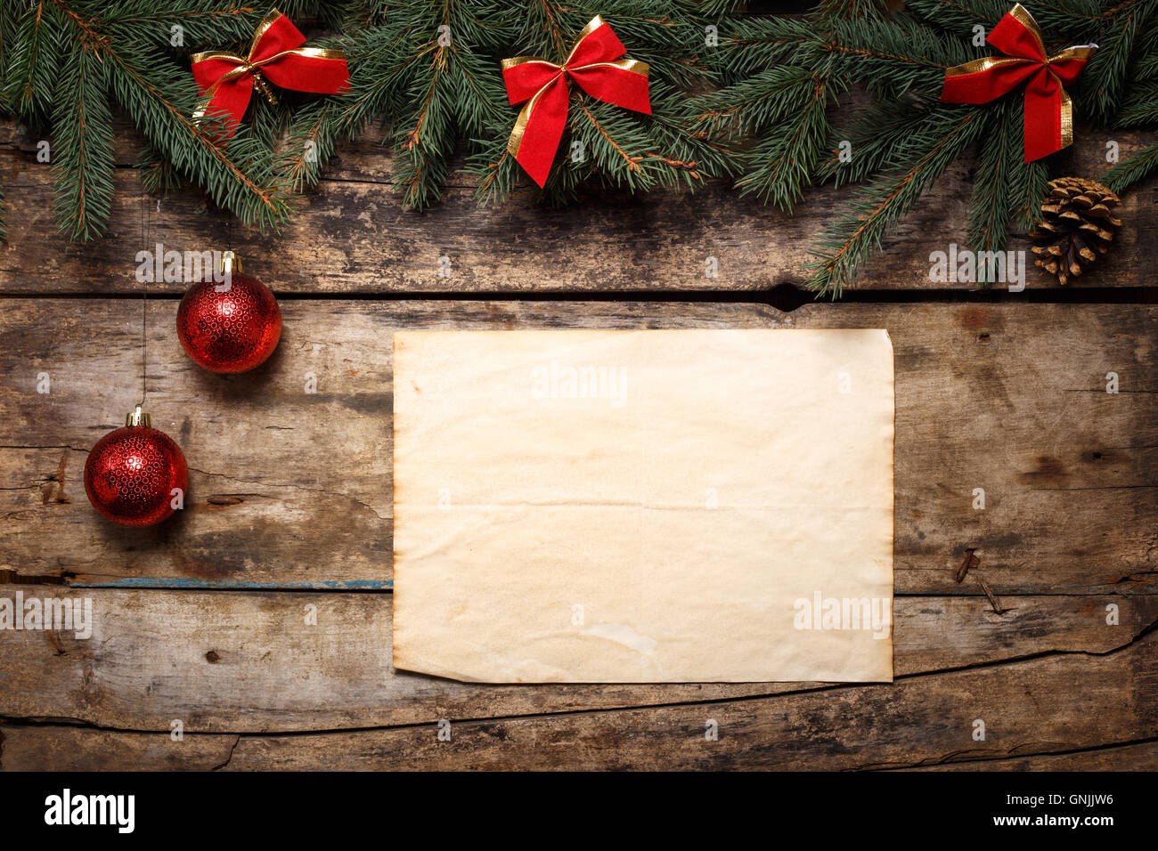 Christmas Fir Tree Frame with vintage paper background. Red bows and ...