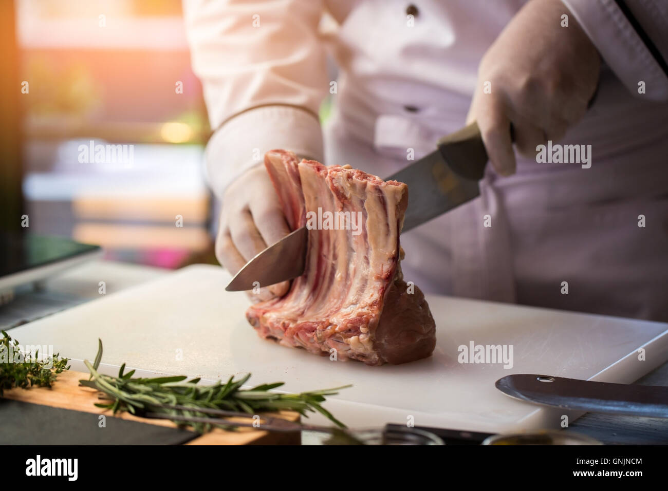 Knife cutting meat with bone Stock Photo Alamy