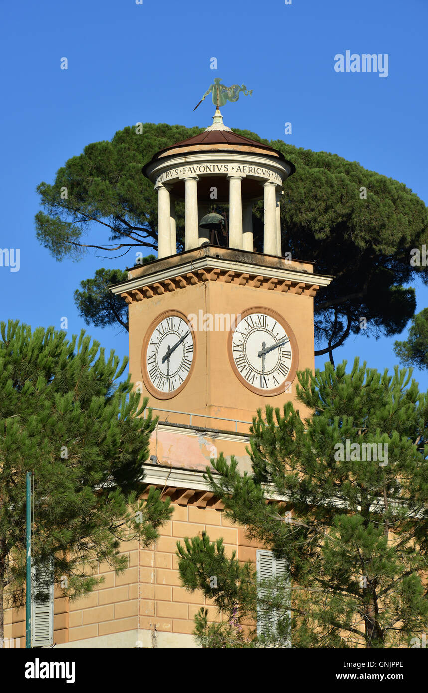 Clock tower at the top of Casina dell'Orologio, in Villa Borghere public park in Rome, made in the 18th century Stock Photo